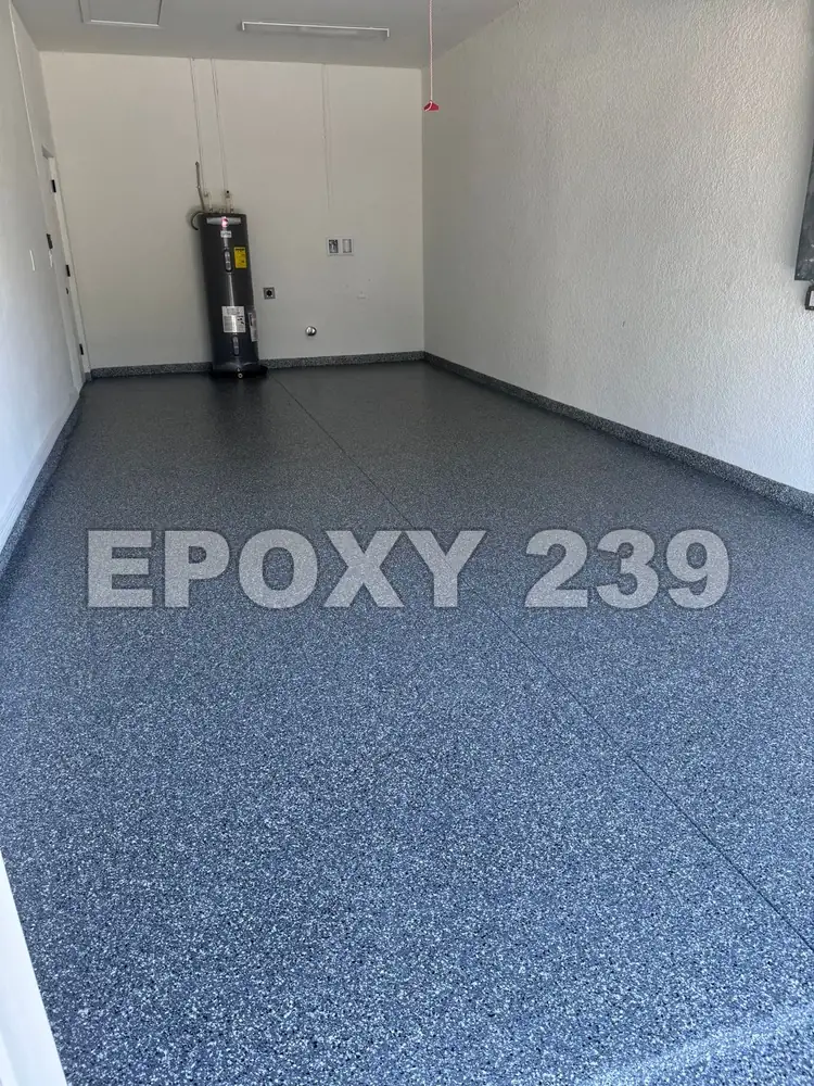 Long garage with a deep blue-grey Wombat flake epoxy floor