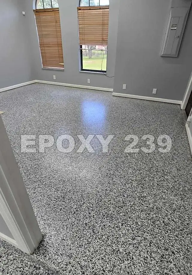 Sunlit room with tall windows reflected in a Domino flake epoxy floor